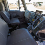 Driver's cab of blood collection specialty vehicle with steering wheel and two seats