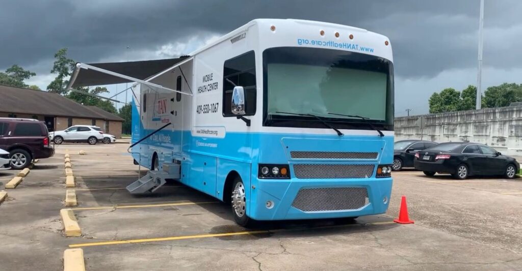 White and turquoise mobile health clinic