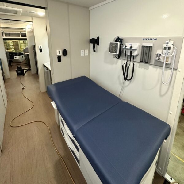 Health care medical bed in a mobile unit
