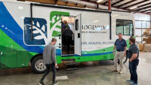 People walking into their new mobile medical unit